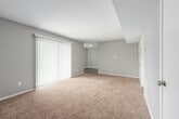 Located at 3073 Panorama E in Birmingham, Alabama, this single-floor, three-bedroom, two-bathroom home offers a practical and comfortable layout. The interior features neutral gray walls, plush wall-to-wall carpeting in all bedrooms, and textured ceilings throughout, creating a consistent and understated aesthetic. The generously sized primary bedroom provides ample living space, while the additional two bedrooms are well-proportioned and connected via a central hallway. Each bedroom includes closet access and multiple electrical outlets. The kitchen is efficiently designed with white cabinetry, dark speckled countertops, wood-look vinyl flooring, a stainless steel sink, and black appliances including a refrigerator and range. The bathrooms feature white cabinetry, dark granite-style countertops, vanity lighting, framed mirrors, and a tiled shower-tub combination. A dedicated utility room and hallway closet add functional storage to the floor plan. Outdoors, the property overlooks a well-maintained green lawn dotted with mature trees, with a tennis court visible in the background, offering a pleasant and active community setting. This home provides a clean, move-in-ready environment in a community-oriented Birmingham neighborhood.