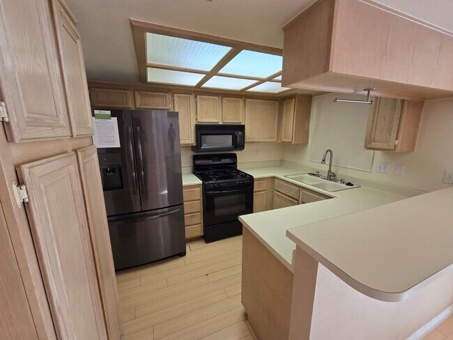 Building Photo - First-Floor 2 Bed / 2 Bath Condo w/ Garage...
