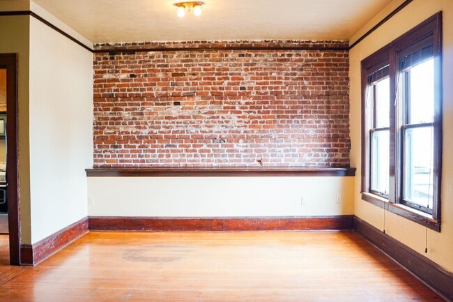 Building Photo - Spacious Vintage 1-Bed with Exposed Brick,...