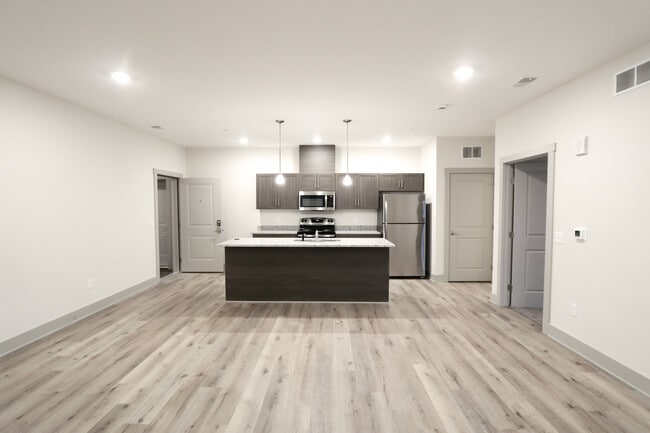 Cocina/Sala de estar - Mona Shores Flats