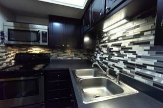 Sleekly Designed Kitchens - Woodland Park Apartments - UTILITIES INCLUDED