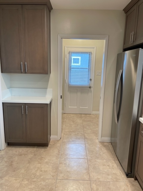 Kitchen into laundry room - 5631 E Vernon St