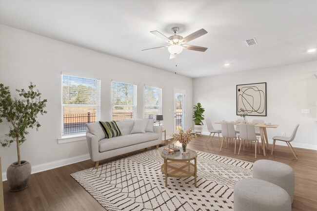 A view of the living room and intimate dining space - Poplar Row