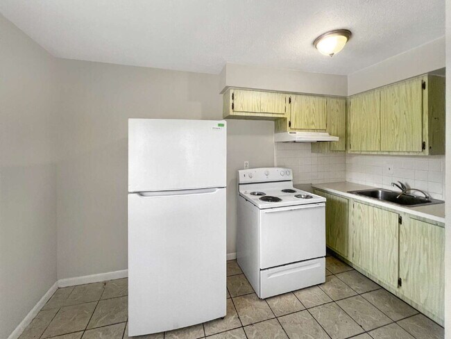 Building Photo - Budget-Friendly. Bold Personality. Big Aut...