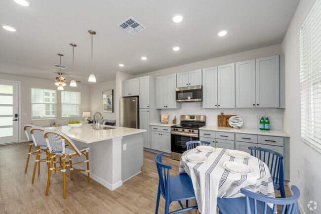 A5 1BR, 1BA - 712SF - Kitchen and Dining Area - The Eleanor at Daytona Beach