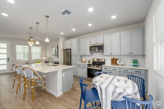 A5 1BR, 1BA - 712SF - Kitchen and Dining Area - The Eleanor at Daytona Beach