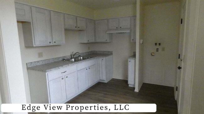 Kitchen - photos of opposite unit. However, this unit has similar finishes & mirror image floor plan - 500 S Darst St