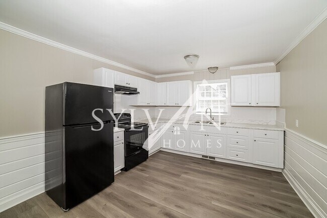 Foto del edificio - Come view this lovely brick home