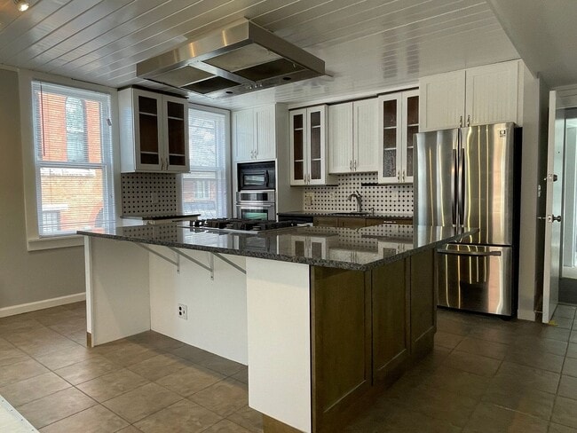 Building Photo - Small pets are welcome with an additional ...