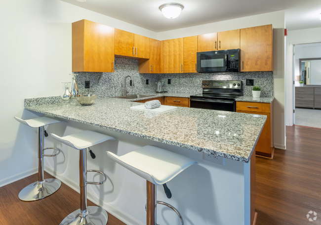 Open kitchen with granite countertops - Bell Estates Apartments