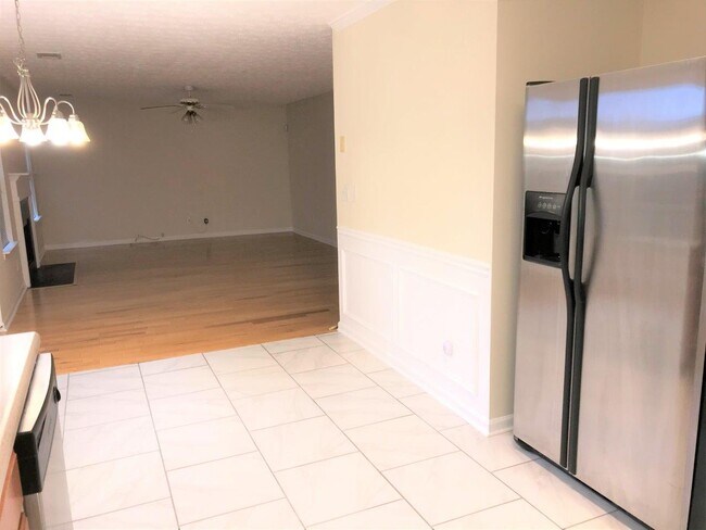 View from kitchen into family room. - 4376 Newton Estates Trl