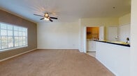 Located on Warwick Pointe Drive in Brandon, Florida, this single-story unit offers a functional and well-organized layout designed for comfortable everyday living. The kitchen serves as a central hub of the home, featuring white cabinetry, dark countertops, stainless steel appliances including a refrigerator, range, microwave, and dishwasher, and light tile flooring. A dedicated pantry with built-in shelving provides generous storage, while a peninsula counter connects the kitchen seamlessly to the living area.

The living space is generously sized, finished with neutral-toned carpet and equipped with a ceiling fan. Multiple windows fitted with blinds allow natural light to fill the room while maintaining privacy. Crown molding accents add a refined touch to the living area.

A dedicated laundry area is conveniently accessible from the main living space and accommodates a full-size washer and dryer. The bathroom is clean and efficiently designed, featuring tile flooring, a white vanity with storage, a mirrored medicine cabinet, and overhead lighting. Additional carpeted rooms offer flexibility and are brightened by natural light through window treatments. Overall, the unit presents a neutral, move-in ready interior with practical features throughout.
