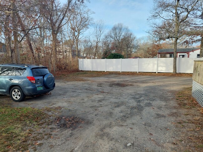 Rear View of Parking Wooded + Secluded - 79 Linden St