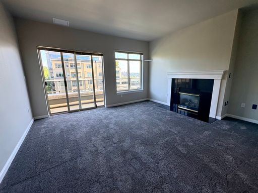 Building Photo - Top-Floor Corner 2BR with Lake Union Views + Garage Parking Included!