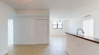 Located at 5225 NW 29th Ave in Miami, FL, this single-floor residence offers a well-organized layout featuring one bedroom, a den, two bathrooms, and an in-unit laundry room. Light-tone ceramic tile flooring runs throughout the entire space, lending a clean, cohesive look to each room.

The entryway opens directly to the kitchen and living area. The kitchen is equipped with stainless steel appliances, including a refrigerator and electric range, light wood cabinetry, dark granite-style countertops, and a double-basin stainless steel sink. A peninsula counter separates the kitchen from the main living area, creating an open, functional flow.

The living area benefits from natural light through large windows and is fitted with a ceiling fan. A hallway connects the private quarters, lined with multiple closets providing generous storage throughout. The bedroom features its own window, a ceiling fan, and a sizable closet. The den offers additional flexible space, also with tile flooring and a closet.

Both bathrooms are finished with tile flooring; one includes a full tub and shower combo with accessibility grab bars and a vanity with dark countertop. The in-unit laundry room adds everyday convenience to this efficiently designed Miami residence.