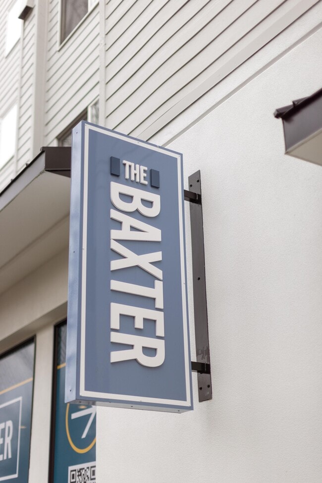The Baxter street sign marks the entrance on NE 2nd Street in Bellevue. - The Baxter