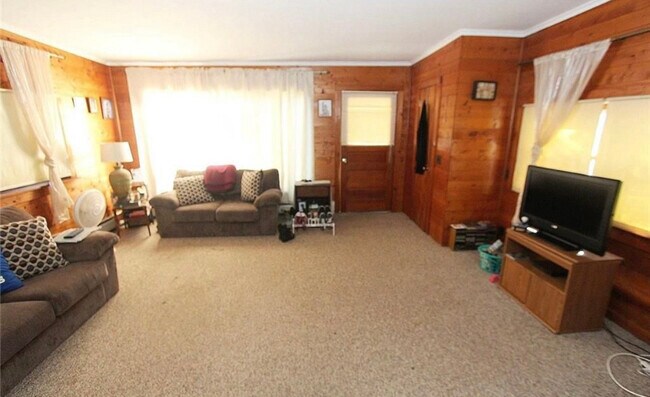 Cozy wood panel in a comfortable family room. - 6163 N Lake Rd