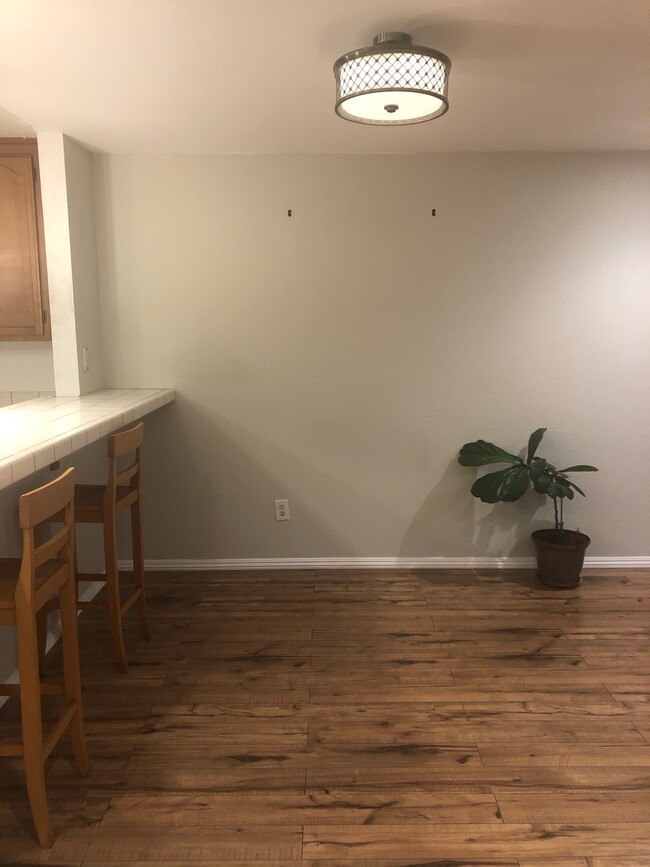 Kitchen with bar seating. - 107 Oak Ct