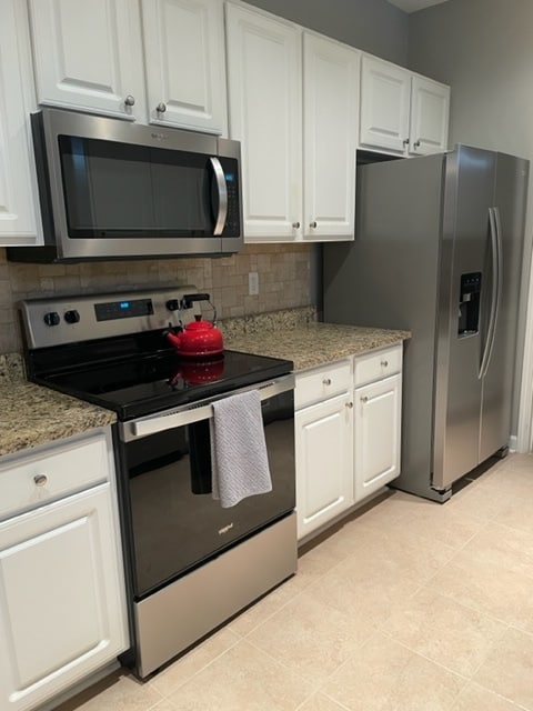electric range, microwave, double sided fridge - 824 Wintercreeper Dr