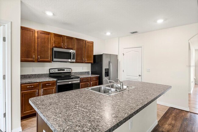 Building Photo - 6381 Trouvaille Pl