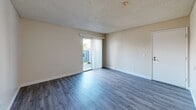 Located at 1326 E Cotati Ave in Rohnert Park, California, this single-story, one-bedroom, one-bathroom unit offers a practical and well-organized layout across a compact yet functional floor plan. The combined living, dining, and kitchen area forms the heart of the unit, featuring light wood-tone laminate flooring, neutral beige walls, and a textured ceiling throughout. The living room benefits from a sliding glass door that opens to an outdoor area, allowing natural light to fill the space. A ceiling fan is present in the combined living and dining area, providing additional comfort.

The kitchen is efficiently designed with white cabinetry, light countertops, a stainless steel refrigerator, dishwasher, and a ceiling fan overhead — offering a clean, functional cooking space. The hallway connects the main living areas to the private bedroom, which features carpeted flooring, a large window with natural light, and access to two closets. The bathroom includes a full tub and shower combination with white tile surround and chrome fixtures. Throughout the unit, the consistent use of neutral tones and updated flooring creates a clean, move-in ready atmosphere suited for comfortable everyday living.