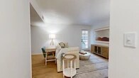 This thoughtfully designed 2-bedroom, 1-bathroom residence in Shreveport, LA offers a comfortable and functional single-floor layout. The bright living room features light wood flooring, a textured ceiling, and large windows with a balcony door that invites abundant natural light and outdoor access. The adjacent dining area includes a ceiling fan and a pass-through window connecting to the kitchen, creating an open and social atmosphere. The galley-style kitchen is outfitted with white cabinetry, black hardware, a skylight, and black appliances, including a full-size refrigerator and dishwasher, complemented by a separate pantry for additional storage. The spacious primary bedroom offers carpeted flooring, a walk-in closet, and a serene, neutral palette. The second bedroom is equally well-sized with carpeted flooring and ample wall space. A dedicated laundry room houses a full-size washer and dryer. The unit also includes a utility room, a hallway with additional closets, and a full bathroom. Throughout, clean white walls and wood-look flooring create a cohesive, modern aesthetic that is both warm and inviting.