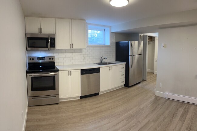 bright kitchen with stainless steel appliances - 1118 Woodroffe Av