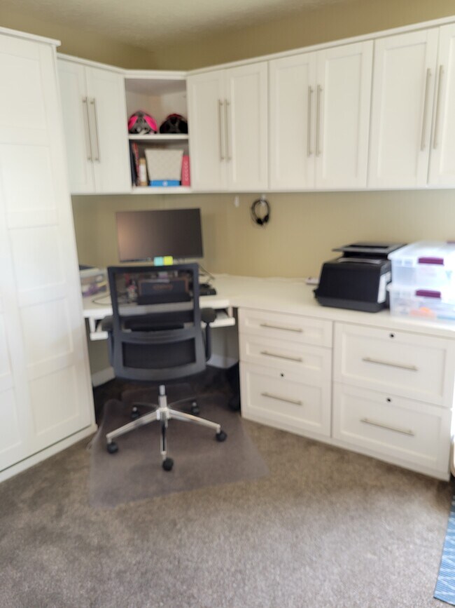 Guest bedroom is set up as an office with full-sized Murphy bed - 4944 Cass St