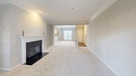 This well-designed 1,170 square foot apartment offers a harmonious blend of comfort and style. The open-concept living area creates a sense of spaciousness, enhanced by crown molding and a sleek fireplace. The modern kitchen boasts white cabinetry, granite countertops, and stainless steel appliances, making it both functional and aesthetically pleasing.

Both bedrooms are generously sized, with the primary bedroom measuring 180 square feet. The two bathrooms feature granite vanity tops and modern fixtures. The apartment showcases a thoughtful mix of flooring, with plush carpeting in the living areas and bedrooms, and elegant hardwood in the kitchen and bathrooms.

Large windows throughout allow for ample natural light, while ceiling fans provide additional comfort. The apartment also includes two closets for added storage. The neutral color palette and clean lines contribute to a contemporary feel, making this space adaptable to various decor styles. Located in Charlotte, NC, this apartment offers a perfect blend of modern amenities and comfortable living spaces.