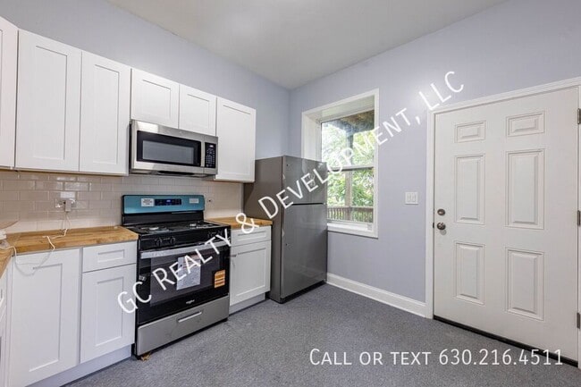 Building Photo - 6433 S Vernon Ave