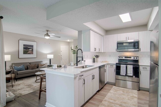 Newly Renovated Kitchen with Quartz Countertops and Stainless Steel Appliances - 1250 West Apartments