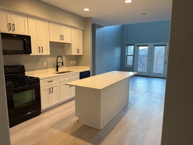 Kitchen view into living room and balcony - 5 S 500 W