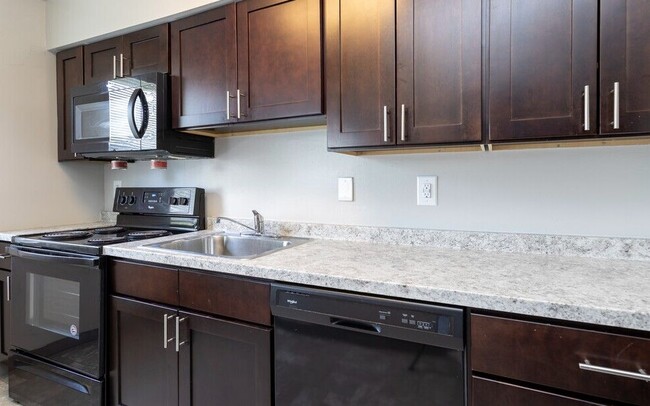 Kitchen-Semi Upgraded - Greens At Forest Park Apartments