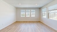 Located at 26222 Krameria Ave in Moreno Valley, CA, this single-story 2-bedroom, 2-bathroom home offers a clean, modern design with thoughtful details throughout. The open-concept living room greets you with light wood-style flooring, recessed lighting, and multiple windows that fill the space with natural light and provide views of the surrounding neighborhood. The well-equipped kitchen is a standout feature, boasting light wood cabinetry, quartz countertops, a central island, stainless steel appliances including a gas range, microwave, refrigerator, and dishwasher, plus a tile backsplash and easy-care wood-style flooring. The spacious primary bedroom offers generous proportions, plush carpeting, and a walk-in closet with built-in shelving and hanging rods. The second bedroom is equally comfortable with soft carpet and a bright window overlooking the outdoors. Both bathrooms are finished with light wood cabinetry, white countertops, large mirrors, and tub/shower combinations with clean tile surrounds and wood-style flooring. A hallway connects the private quarters, enhancing the home's functional layout. The neutral color palette and modern finishes create a bright, welcoming ambiance throughout this well-designed Moreno Valley residence.