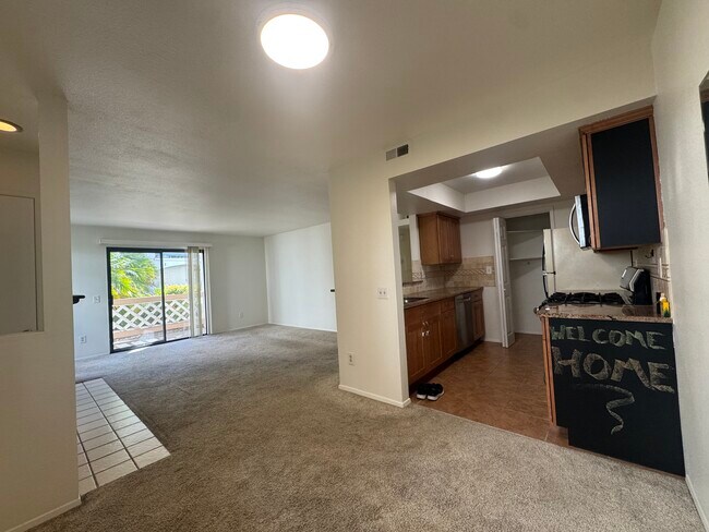 Kitching, living room, and balcony/patio - 9408 Twin Trails Dr