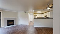 Located at 4949 Snyder Ln in Rohnert Park, CA, this well-appointed two-bedroom, two-bathroom residence offers a comfortable and functional single-floor layout. The open-concept living and kitchen area serves as the heart of the home, where warm wood-look flooring flows throughout. Crown molding adds a refined touch to the living room, which is anchored by a tiled fireplace with a white wood mantle and a sliding glass door that fills the space with natural light and provides outdoor access.

The kitchen is efficiently designed with crisp white cabinetry, gray countertops, a breakfast bar peninsula, and a full suite of stainless steel appliances including a range, over-the-range microwave, dishwasher, and refrigerator. A ceiling fan keeps the space comfortable year-round.

Both bedrooms offer plush carpeting and ample closet space, with the second bedroom featuring a bright window overlooking the outdoors. The two bathrooms are finished with white cabinetry, gray countertops, and wood-look flooring. One bathroom includes a shower/tub combination, while both offer clean, functional layouts. Hallways connect the spaces seamlessly, completing this tidy and well-maintained home.
