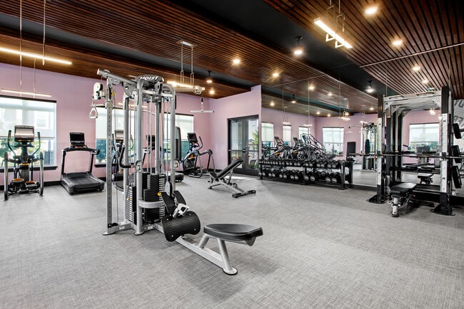 Stay active with a fully equipped fitness center right at home. - Lofts at Highlands