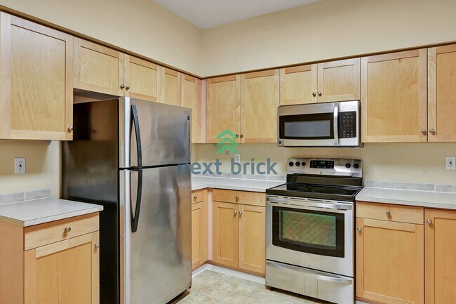 Building Photo - Rare Ground-Floor, End Unit with massive b...