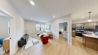 This 850 square foot apartment in Fort Wayne, Indiana, offers a thoughtfully designed living space with two bedrooms and one bathroom. The layout maximizes functionality within its compact footprint, featuring an open-concept design that combines the kitchen and living room for a spacious feel.

The primary bedroom, measuring 130 square feet, provides ample space and is complemented by a second bedroom. The apartment's single bathroom is efficiently designed to serve both bedrooms and common areas. Throughout the space, light-colored walls and wood flooring create a bright, airy ambiance.

The kitchen boasts modern amenities, including stainless steel appliances, granite countertops, and wooden cabinetry. The living area is versatile, accommodating both lounging and dining functions. Large windows in the bedrooms and living space allow natural light to flood the interior, enhancing the sense of openness.

Storage solutions are integrated throughout, with a dedicated closet and built-in shelving in various rooms. The apartment's decor strikes a balance between contemporary and cozy, featuring a neutral color palette accented with pops of color in furnishings and artwork.

This well-appointed apartment offers a harmonious blend of style and practicality, ideal for those seeking a modern living space in an urban setting.