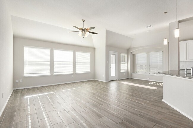 Building Photo - This charming 3-bedroom, 2-bath home features an open-concept layout with a bright kitchen, grani...