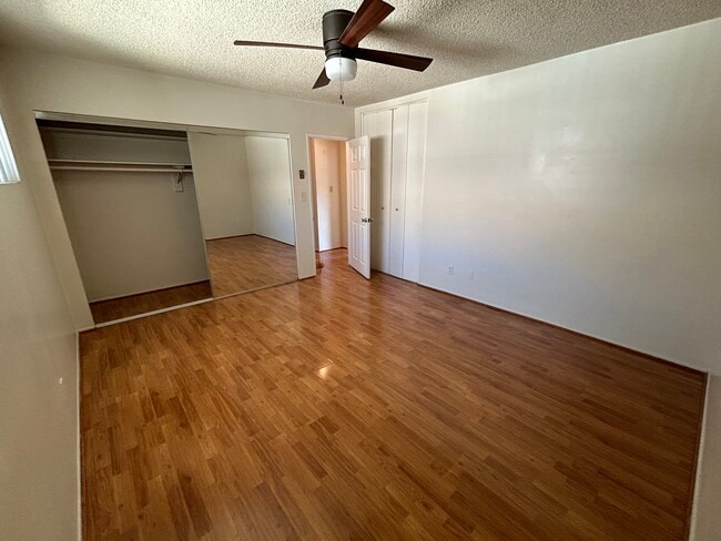 Bedroom (two closets, ceiling fan, and window AC unit) - 147 Genoa St
