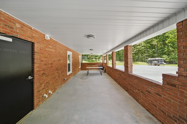 Rear entrance & ommon area covered space for units C&D to use on rear of building - 216 Legion Dr