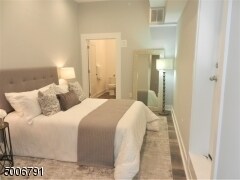 Staged View: Primary B/R w/Ensuite, Deep Walk-In Closet & Access To Enclosed Roof Top Deck - 346-3 Millburn Ave