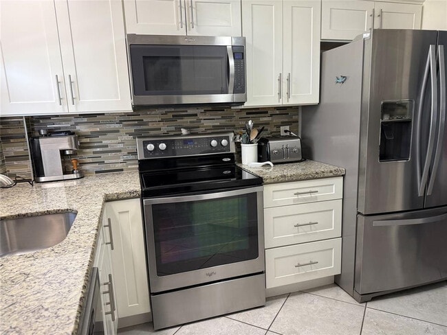 Building Photo - 1161 Hillsboro Mile