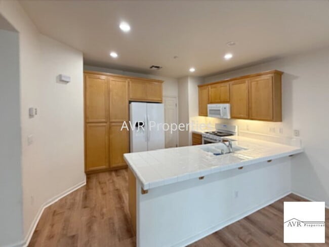 Building Photo - Spacious home with a large open concept kitchen, dining and living room
