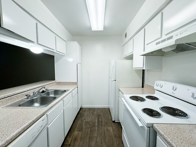 Large kitchen with island and premium appliances - Memorial City Apartments