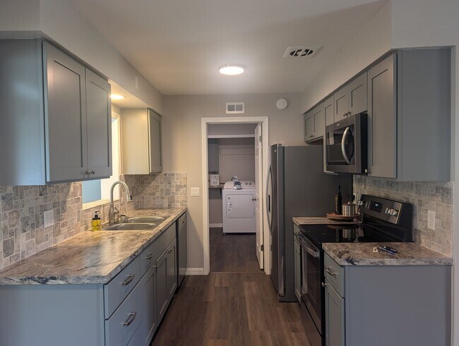 Building Photo - Totally Updated Unfurnished 2/1.5 bath hom...