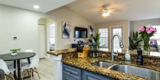 Kitchen with stone counters - 8923 Manor Loop