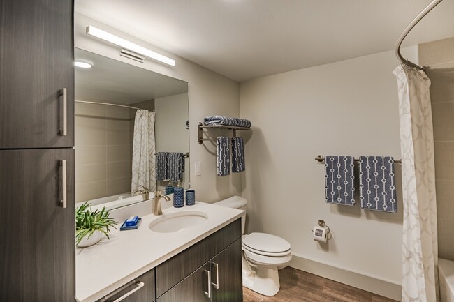 Bathrooms with linen closets for ample storage - Metro 112 Apartments