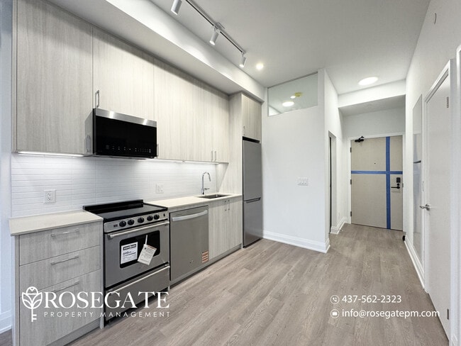 Photo du bâtiment - Modern 1 Bedroom + Den (Potential 2nd Bedroom) Condo with Parking & Balcony